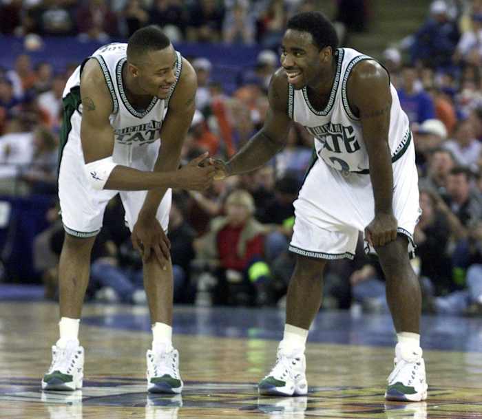Michigan State Spartans guard Mateen Cleaves celebrates with a teammate.